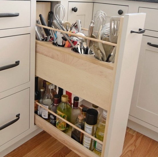 a narrow drawer with utensil holders and oils and spices is a perfect idea for every kind of kitchen