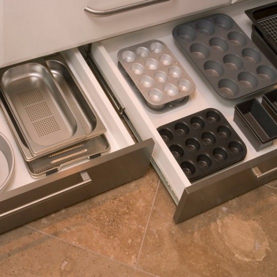 low drawers under the cabinets can be used for storing lids, forms and cutting boards as they will easily fit