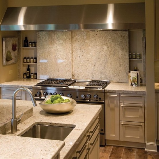a cooker backsplash that is sliding and that hides some spices behind it is a very cool and smart idea