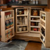 a deep cabinet with several wooden storage compartments inside is a clever idea for those who want to get maximum of their space
