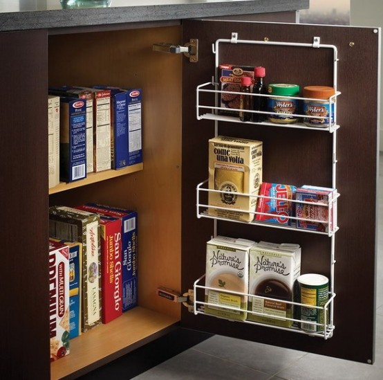 a small dark-stained cabinet with a little rack attached to the door that allows storing a lot of stuff inside