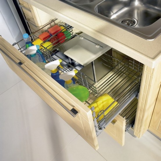 a drawer under the sink with comfortable metal wiring to store various chemicals and other kitchen stuff