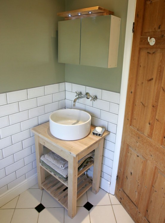 an IKEA Oddvar stool turned into a vanity in a contemporary bathroom is a very fresh idea