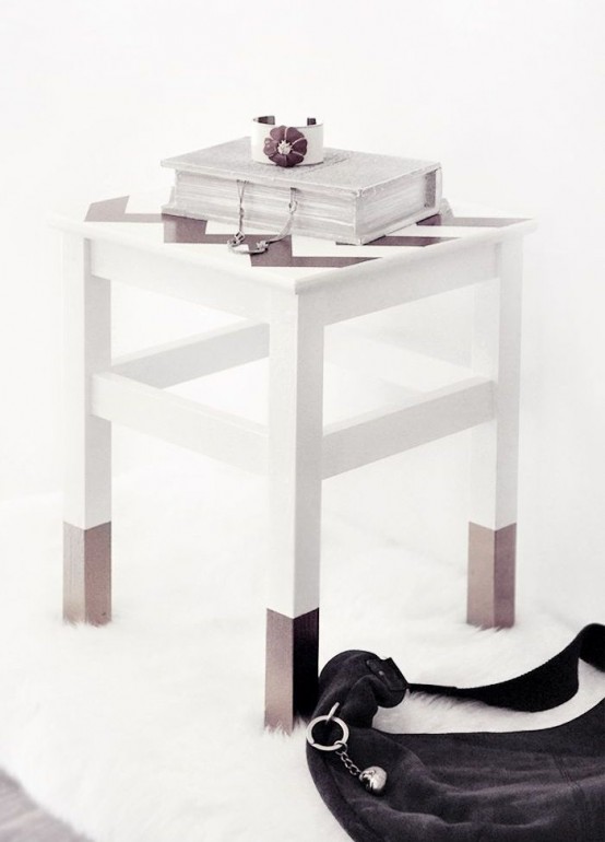 an IKEA Oddvar stool with paint dipped legs and a chevron painted seat can be used as a side table