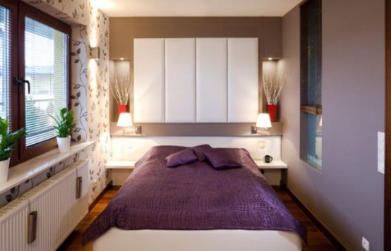 a cozy modern bedroom with white and purple walls, a white storage unit and a bed, potted greenery and lamps