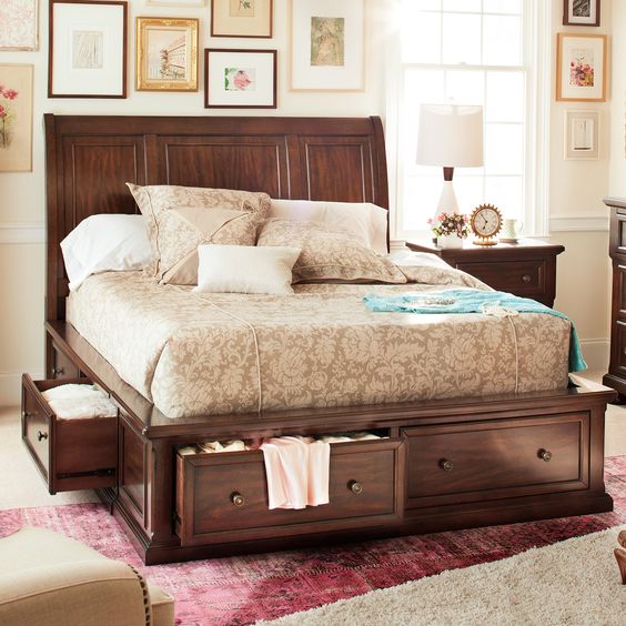 a dark stained bed with lots of drawers with knobs is a perfect piece to rock in your space