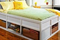 a white beadboard bed with open storage compartments with woven boxes and without is a cool solution to get more storage space
