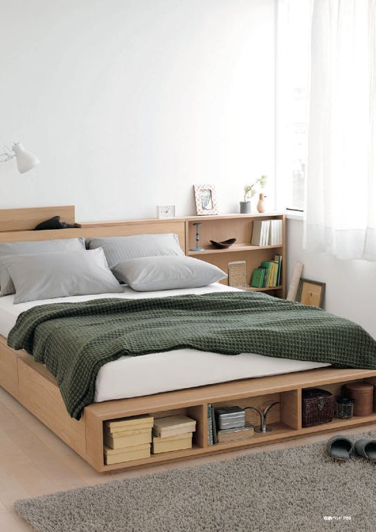 a minimalist light-stained bed with side drawers and an open storage compartment at the foot of the bed plus storage nightstands is a cool solution for a small bedroom