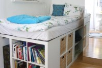 a white storage bed with lots of open storage compartments and some basket drawers is a cool option to go for