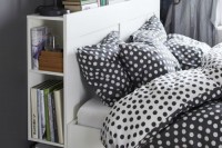 a functional white bed with an open storage compartment in the headboard and a couple of drawers underneath is a perfect modern solution