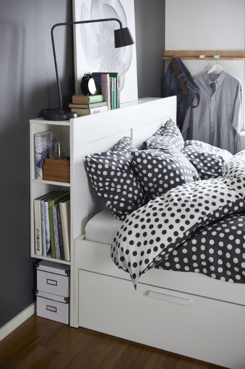 a functional white bed with an open storage compartment in the headboard and a couple of drawers underneath is a perfect modern solution