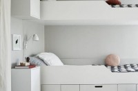 a minimalist white bed with storage compartments and drawers is a lovely piece for a modern space and the compartments are comfy to use