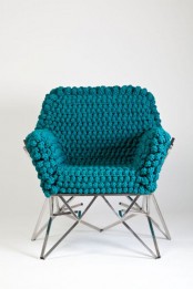 a sturdy chair with a super cozy and comfortable blue crochet cover is a bold and chic furniture piece to rock