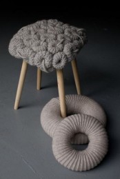 a super cozy knit stool with a quirky seat is a very cool and bold idea to finish off a modern interior