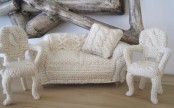 a set of a sofa with pillows and vintage chairs covered with white crochet are a fun way to cozy up your space for cold days