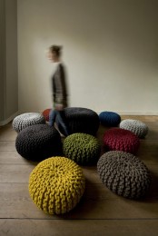 an arrangement of colorful chunky crochet ottomans will be your conversation pit or you can just accent your space with a piece like that