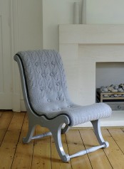 a vintage grey chair finished off with a grey knit cover to make it cozier and cooler