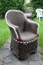 a vintage chair with a grey knit cover and knitted flowers for decor is a very cool idea to rock