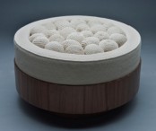 a round seat filled with crocheted balls is a whimsy and non-typical piece of furniture to rock