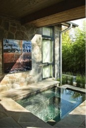 a sunken stone bathtub under a roof will help you avoid excessive sunlight and rain if any