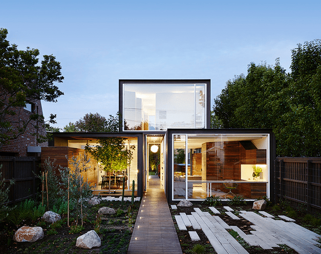 Stacked Volumes Home With Moving Walls And Raised Pool