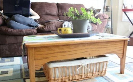 a lwo wooden coffee table with a basket for storage is a cool and cozy rustic idea