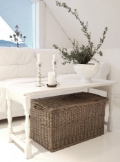 place a large woven box under the table to use it for closed storage comfortably