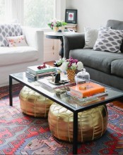 a glass coffee table will make your metallic poufs visible and you can store them there comfortably