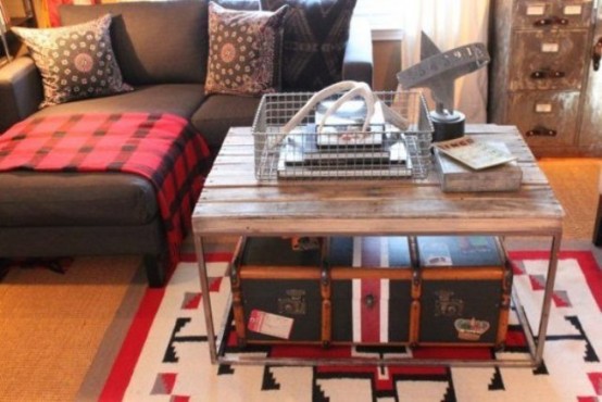 a rustic coffee table and a vintage suitcase inside it to use it for storage and as decor