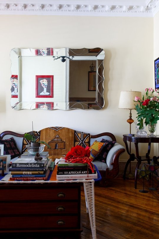 a coffee table with a dresser that is placed strategically to save some floor space