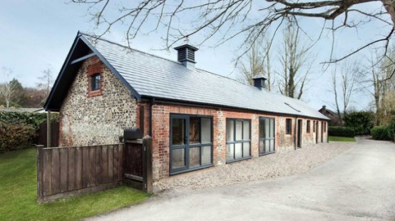 Striking Stable Conversion With Old Wooden Beams Left