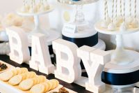 striped navy dessert table for a boy baby shower