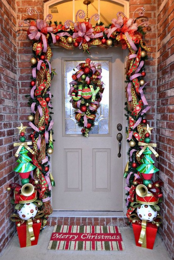 a super colorful garland to contour the door - bright ribbons, ornaments, letters, musical instruments and colorful trees