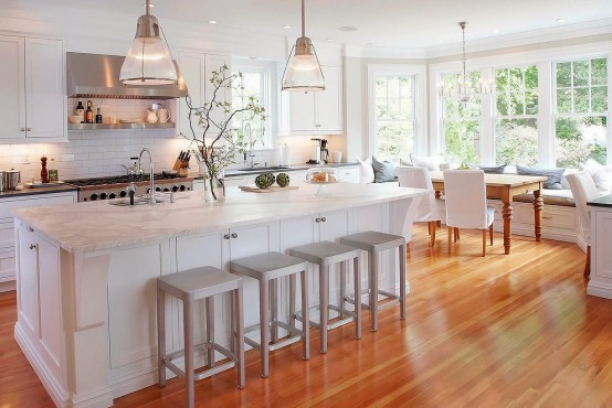 Stunning White Kitchen With A Corner Sofa And Smart Storage