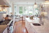 Stunning White Kitchen With A Corner Sofa And Smart Storage