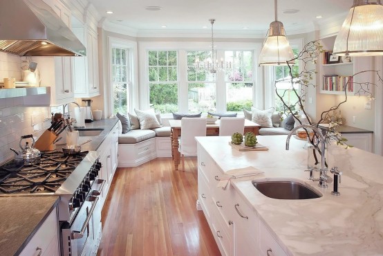 Stunning White Kitchen With A Corner Sofa And Smart Storage