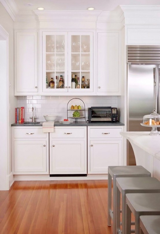 Stunning White Kitchen With A Corner Sofa And Smart Storage