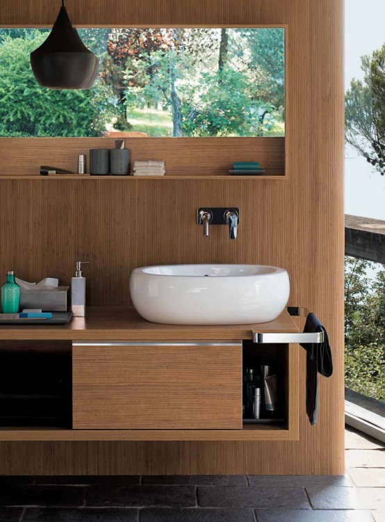 a contemporary bathroom with a wooden wall, a matching storage unit, a sink, a pendant lamp and a gorgeous view is a chic idea