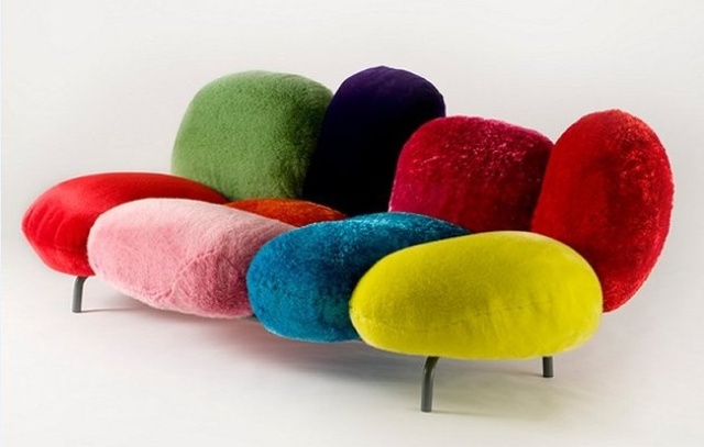 a colorful sofa of an irregular shape is a lovely idea for a bold and bright space in a catchy mix of styles