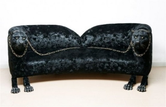 a unique black sofa with pumas on both sides, with paws as legs and chain on top is a bold and catchy idea for a modern space