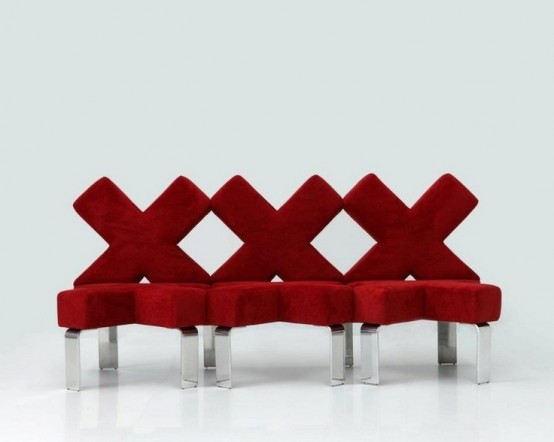 a red criss cross shaped sofa on tall metal legs is a cool and bold idea for a modern space, it will add interest with color and shape