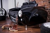 black sofa made of a vintage car, with black leather upholstery is a cool idea for those love vintage and exquisite cars