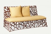 a bold and catchy sofa with a bold geometric base of metal and yellow upholstery with pillows is a lovely solution for both outdoors and indoors