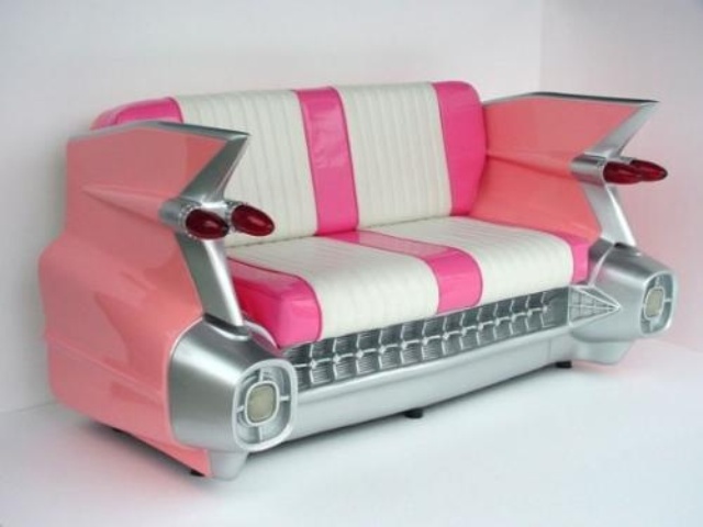 a pink and white sofa styled as part of a retro car is a creative and bold idea that will make a statement