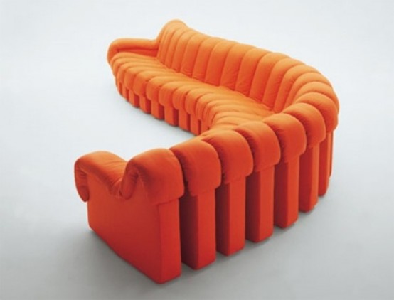 a curved orange sofa that is composed of multiple pieces is a lovely idea for a bold modern space, it will add a lot of color