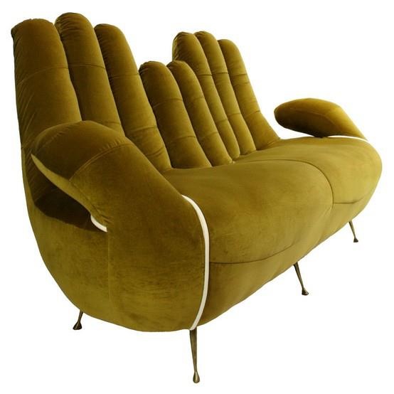 a mustard hand shaped sofa on metal legs will be a unique and catchy idea for an eclectic or boho space, it will add a bit of color