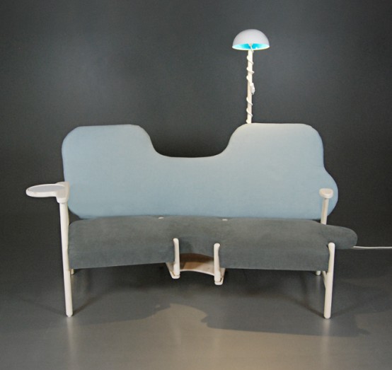 a unique loveseat shaped as a piece of puzzle, with wooden armrests and legs is a fun and cool idea for a modern space