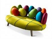 a creative and colorful sofa with bright egg-shaped pillows is a fun and cool idea for a modern and bold space