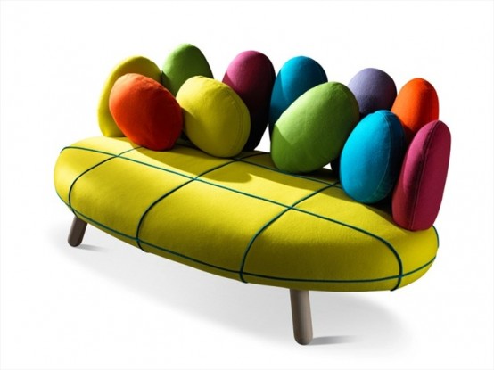 a creative and colorful sofa with bright egg-shaped pillows is a fun and cool idea for a modern and bold space