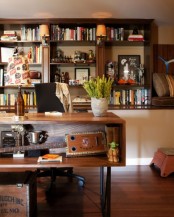 a mid-century modern home office with rich stained wooden furniture, a desk with storage, lamps and potted greenery